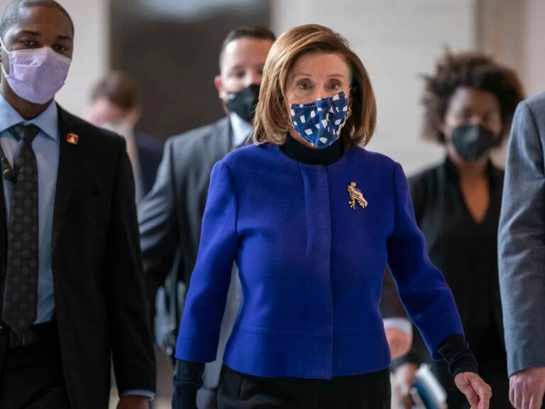 Speaker of the House Nancy Pelosi, D-Calif., arrives to update reporters on the must-pass priority of funding the government, during a news conference at the Capitol in Washington, Thursday, Dec. 2, 2021.