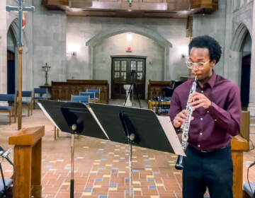Mekhi Gladden playing the oboe in a church