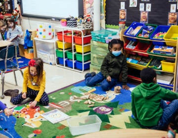 Inside the classrooms, teachers have masked the crumbling building with brightly colored rugs, decorations, reading and play nooks, and educational materials