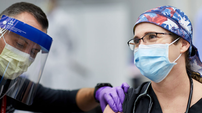 When Dr. Tiffany M. Osborn received her COVID-19 vaccination shortly after vaccines became available in late 2020, she felt hopeful about the pandemic's trajectory. A year later, she's sad and frustrated to see so many COVID patients in the ICU.
Matt Miller / Washington University School of Medicine