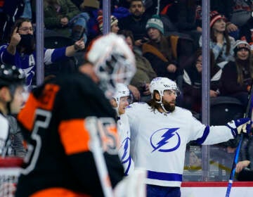 Tampa Bay Lightning's Pat Maroon, right, celebrates after scoring a goal against Philadelphia Flyers' Martin Jones, left