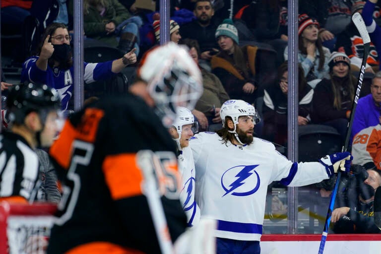 Tampa Bay Lightning's Pat Maroon, right, celebrates after scoring a goal against Philadelphia Flyers' Martin Jones, left