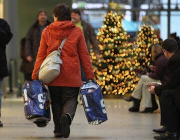 A woman carries shopping bags through a shopping mall on November 22, 2010 in Berlin, Germany. German retailers are hoping for a strong Christmas season on the heels of a robust German economic turnaround following the financial crisis of 2009.  (Photo by Sean Gallup/Getty Images)