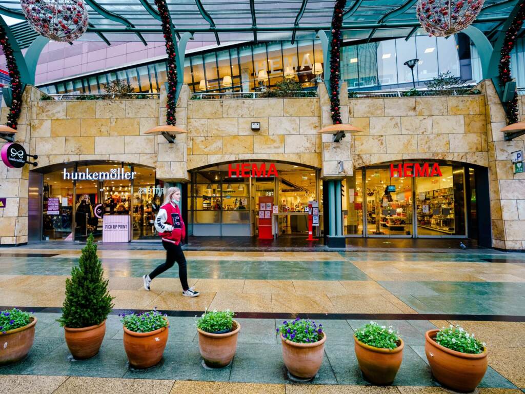 A passer-by walks downtown Rotterdam