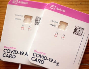 In this photo illustration, An at-home COVID-19 test by Abbott shows a positive result on September 14, 2021 in Chicago, Illinois. At-home tests are becoming increasingly difficult to find despite manufacturers boosting production as COVID-19 cases rise in schools and employers increase monitoring