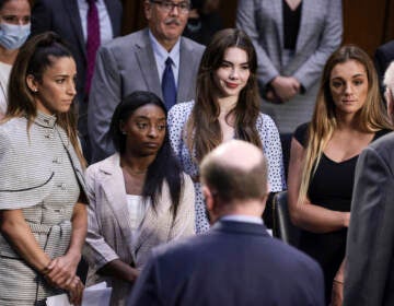 From left, U.S. Olympic gymnasts Aly Raisman, Simone Biles, McKayla Maroney and NCAA and world champion gymnast Maggie Nichols are shown after their testimony during a Senate Judiciary hearing on Sept. 15 about the FBI handling of the investigation of Larry Nassar's sexual abuse of gymnasts. (Anna Moneymaker/Getty Images)