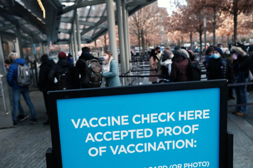 A sign asks for proof of vaccination