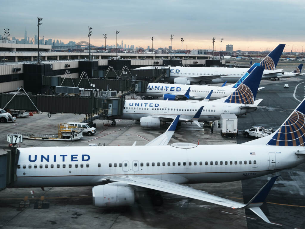 United Airlines planes sit on the runway