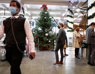 People wear face coverings inside Grand Central Market