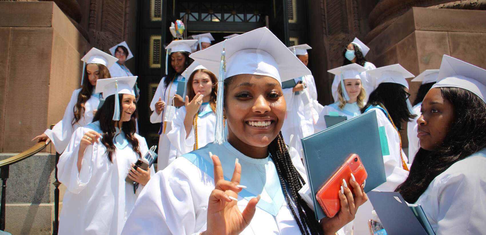 Members of John W. Hallahan Catholic Girls’ High School Class of '21, the school's last class, leave the Basilica of Saints Peter and Paul after their graduation ceremony