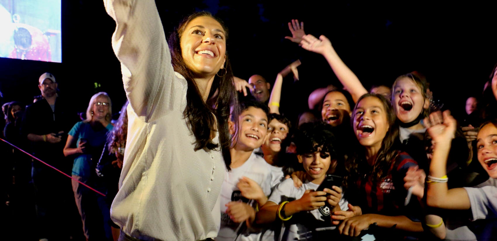 Carli Lloyd takes a selfie with some young soccer fans during a celebration of her storied soccer career in her hometown of Delran, N.J.