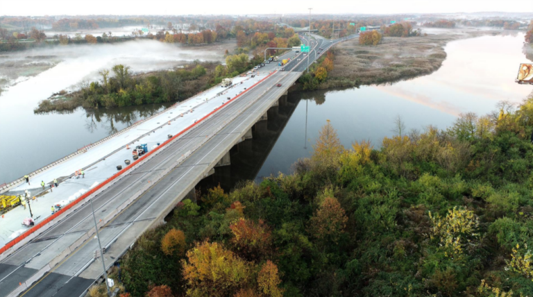 Aerial view of I-95, including the river beneath it and trees on the sides of the highway.