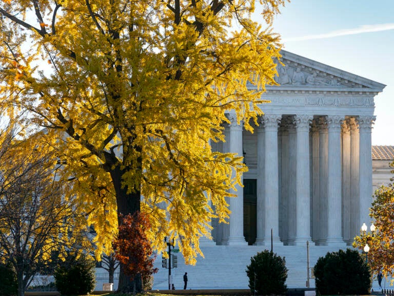 Light from the morning sun illuminates the Supreme Court