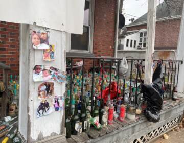 Photos, candles and bottles dominate the shrine for 18-year-old Zion Davis-Shelton, who was gunned down Oct. 24 in the unit block of West 27th Street