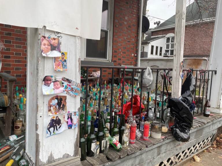 Photos, candles and bottles dominate the shrine for 18-year-old Zion Davis-Shelton, who was gunned down Oct. 24 in the unit block of West 27th Street