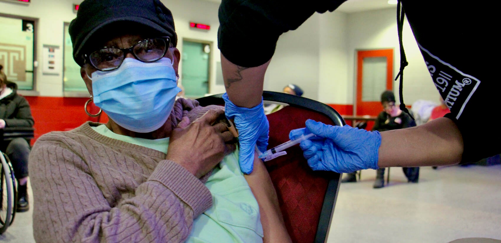 Edna Evans, 88, gets a COVID-19 vaccination at the Liacouras Center at a vaccine clinic organized by the Black Doctors Consortium.