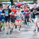Broad Street Race participants are pictured running in the rain