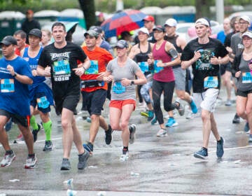 Broad Street Race participants are pictured running in the rain