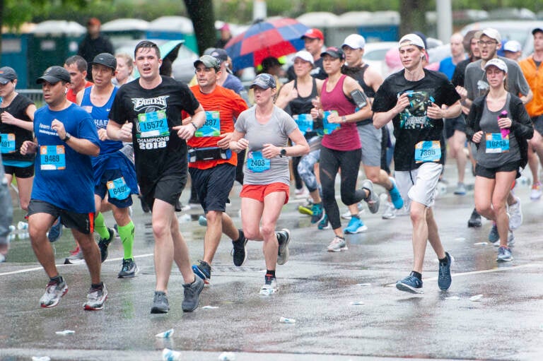 Broad Street Race participants are pictured running in the rain