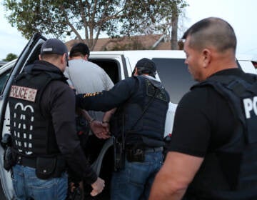 ICE Field Office Director, Enforcement and Removal Operations, David Marin and U.S. Immigration and Customs Enforcement's (ICE) Fugitive Operations team arrest a Mexican national at a home in Paramount, California, U.S., March 1, 2020. REUTERS/Lucy Nicholson