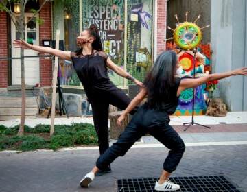 Caitlin Green and Ani Gavino perform on Maplewood Mall in Germantown in March 2021, as part of Painted Bride’s ''Grace Period: A Community Ritual for Collective Healing.''  (LaNeshe Miller-White)