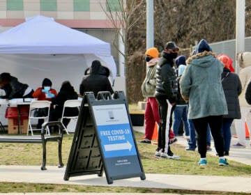 People line up for free COVID-19 tests outside Cibotti Recreation Center in Southwest Philadelphia. The clinic, operated by a testing contractor hired by the Centers for Disease Control and Prevention, will be able to test more than 500 people per day. (Emma Lee/WHYY)