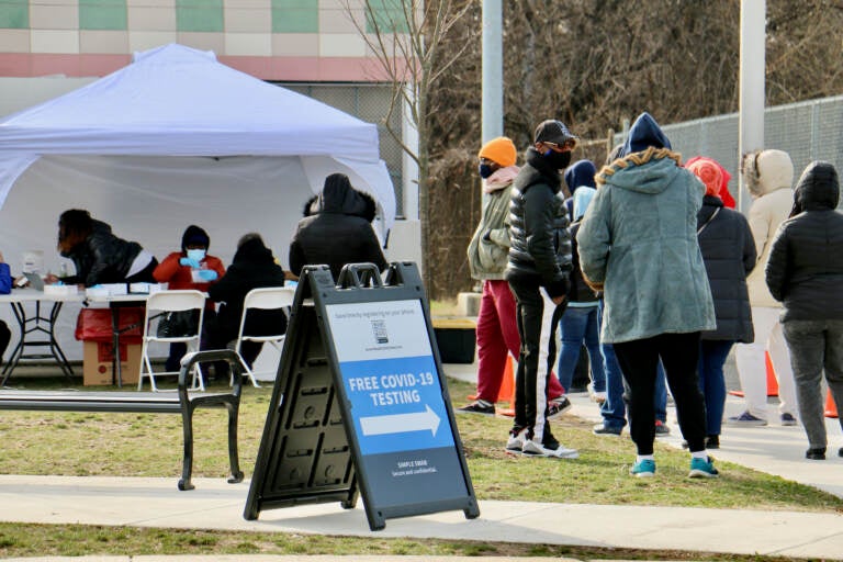 People line up for free COVID-19 tests outside Cibotti Recreation Center in Southwest Philadelphia. The clinic, operated by a testing contractor hired by the Centers for Disease Control and Prevention, will be able to test more than 500 people per day. (Emma Lee/WHYY)