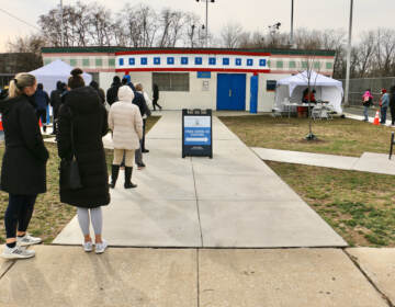 People line up for free COVID-19 tests outside Cibotti Recreation Center in Southwest Philadelphia. (Emma Lee/WHYY)