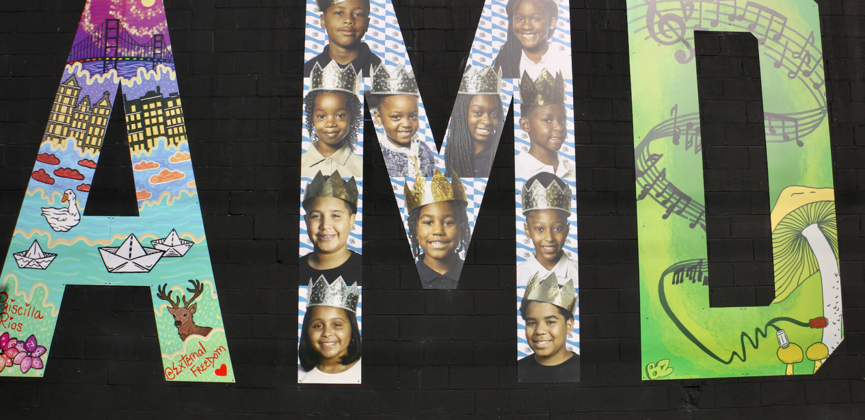 Erik James Montgomery, a fine art photographer, created the letter M using photographs of children’s faces. (Emma Lee/WHYY)