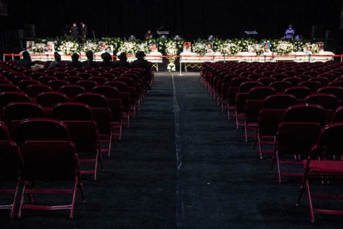 Caskets are seen during a funeral at Temple's Liacouras Center