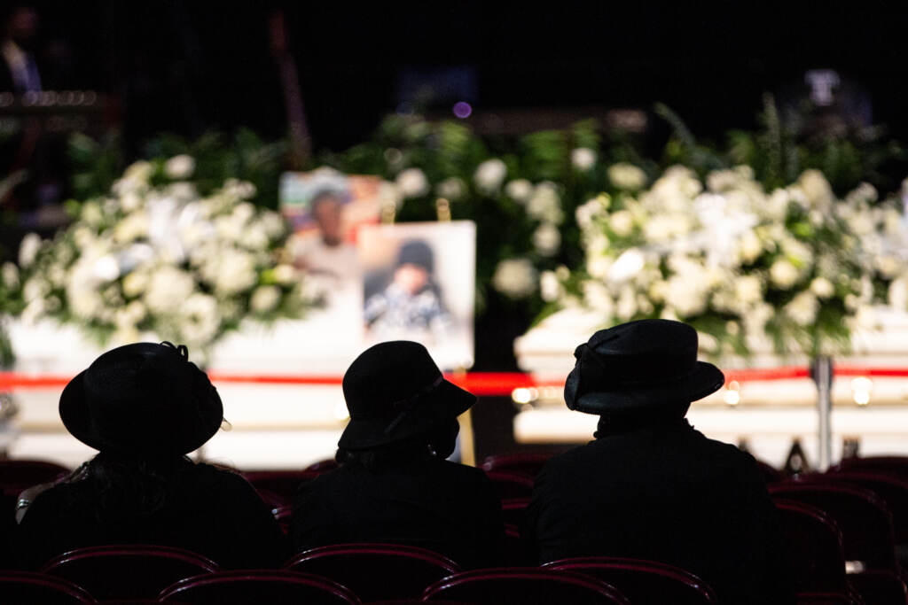 Caskets are seen during a funeral at Temple's Liacouras Center