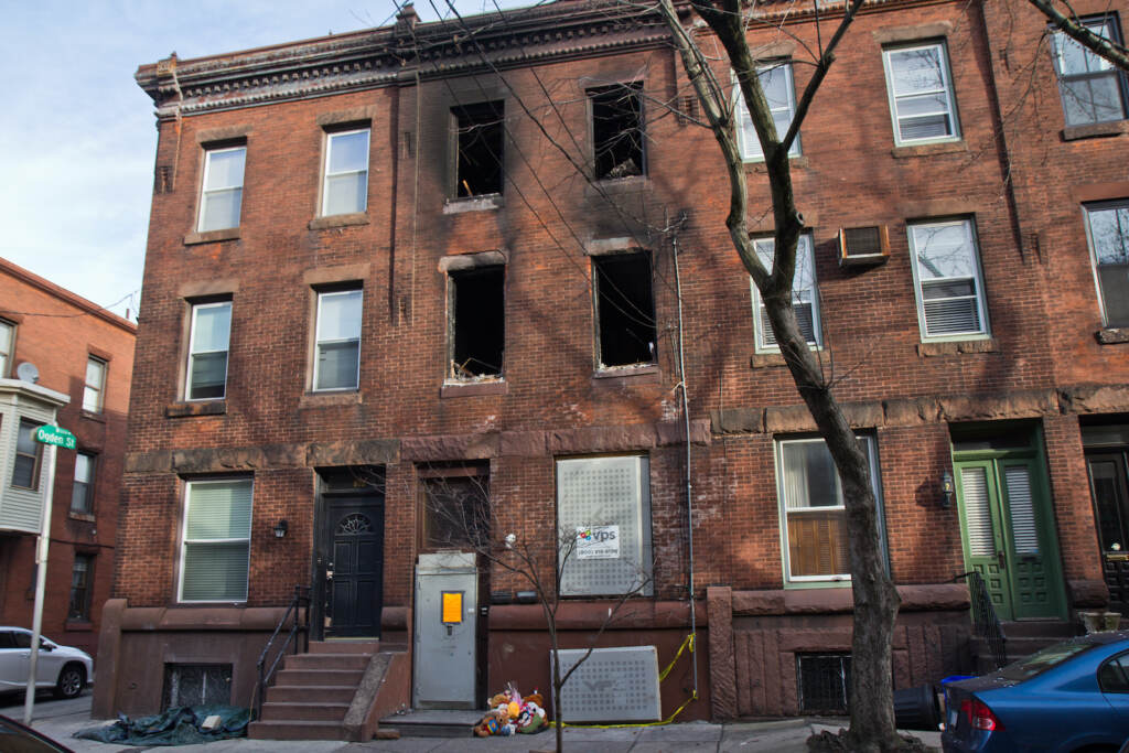 Teddy bears are placed outside the North 23rd Street rowhouse