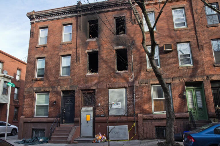 Teddy bears are placed outside the North 23rd Street rowhouse