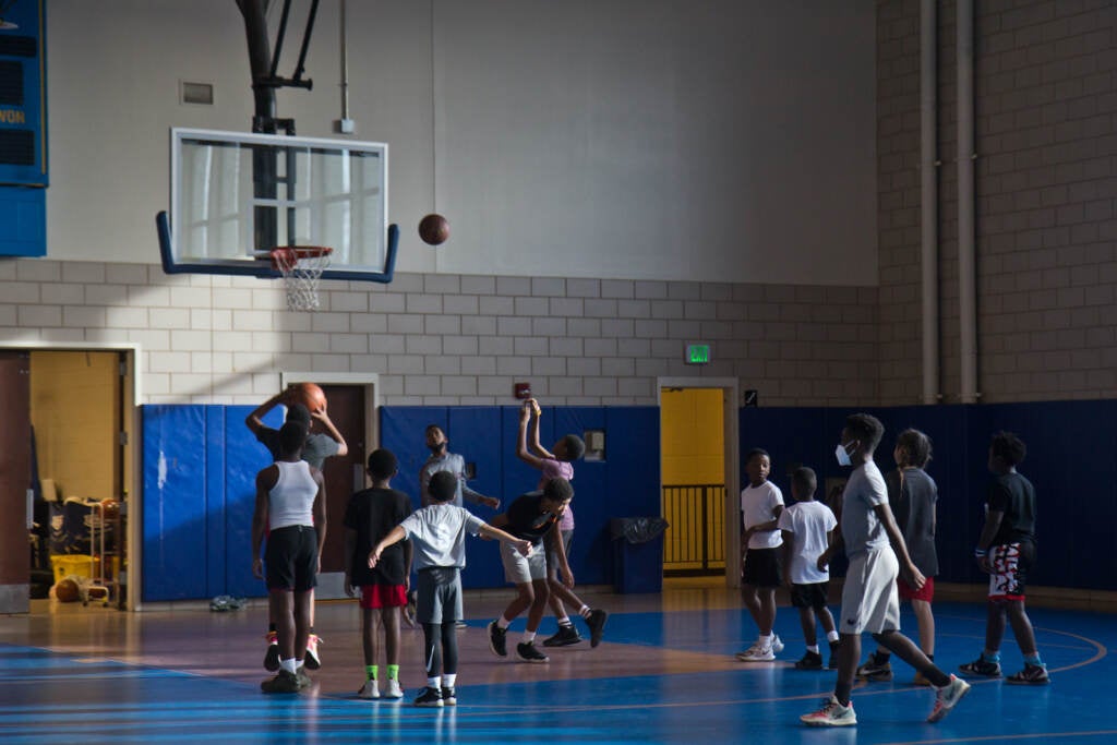 The Give And Go 12 and Under basketball athletes run drills