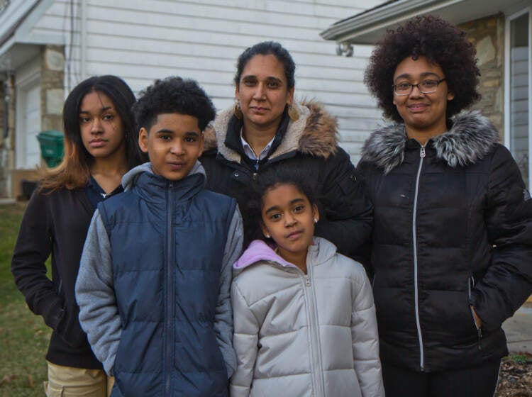 Amina Malik (center), with her children (from left) Rabiyyah, 13, Sadat, 10, Raina, 8, and Ruqayyah, 18, in their yard in Northeast Philadelphia.