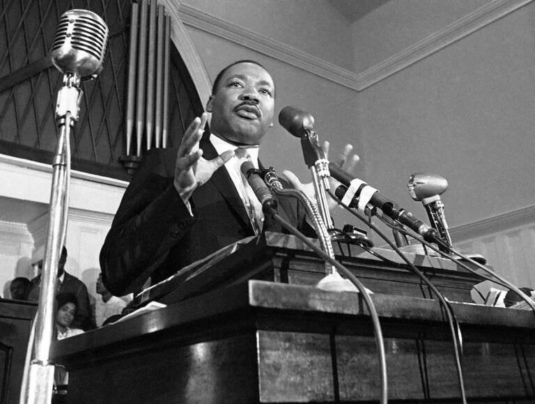 In this 1960 file photo, Martin Luther King Jr. speaks in Atlanta. The civil rights leader had carried the banner for the causes of social justice — organizing protests, leading marches and making powerful speeches exposing the scourges of segregation, poverty and racism