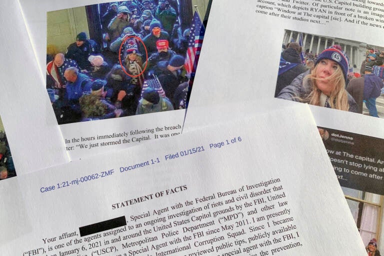 FILE - This statement of facts from the FBI in support of bringing charges against Jennifer Leigh Ryan of Frisco, Texas, is photographed on Nov. 4, 2021. The Texas real estate agent who bragged she wasn't going to jail for storming the U.S. Capitol because she is white, has blond hair and good job has been sentenced to two months behind bars. (AP Photo/Jon Elswick, File)