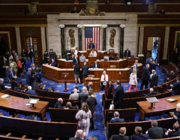 FILE - Members of the House of Representatives gather in the chamber to vote on creation of a select committee to investigate the Jan. 6 Capitol insurrection, at the Capitol in Washington, on June 30, 2021. (AP Photo/J. Scott Applewhite, File)