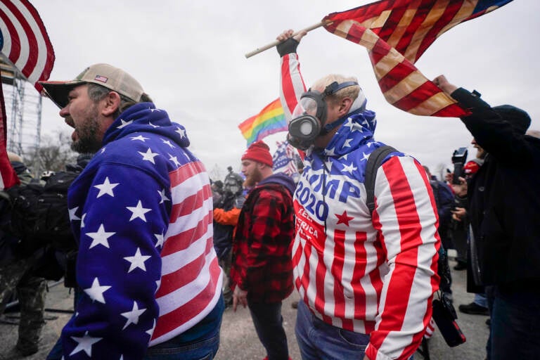 Pro-Trump insurrectionists yell on the West Front of the U.S. Capitol