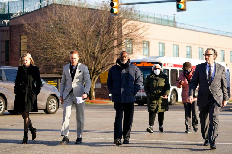 Willie Stokes, center, walks from a state prison in Chester, Pa., on Tuesday, Jan. 4, 2022 after his 1984 murder conviction was overturned because of perjured witness testimony. Stokes was serving a life sentence and spent decades in prison before learning the witness who testified against him at a 1984 court hearing soon pleaded guilty to perjury over the testimony.