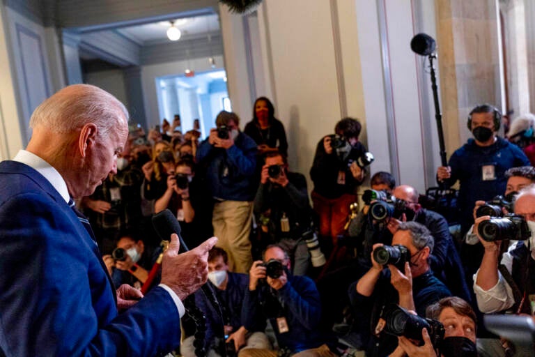 President Joe Biden pauses while speaking to members of the media as he leaves a meeting with the Senate Democratic Caucus to discuss voting rights and election integrity on Capitol Hill in Washington, Thursday, Jan. 13, 2022. (AP Photo/Andrew Harnik)