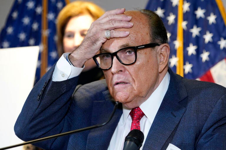 FILE - In this Nov. 19, 2020, file photo, former New York Mayor Rudy Giuliani, who was a lawyer for President Donald Trump, speaks during a news conference at the Republican National Committee headquarters in Washington. The House committee investigating the Capitol insurrection has issued subpoenas to some of Donald Trump's closest advisers, including Rudy Giuliani Sidney Powell stands behind