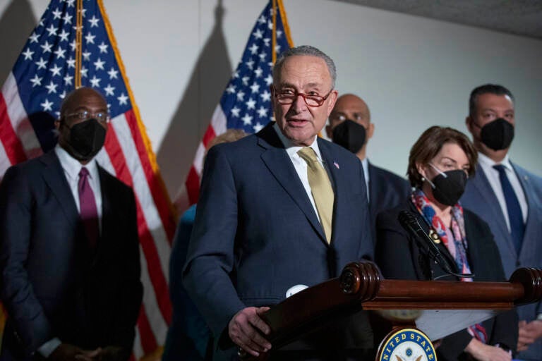 Senate Majority Leader Chuck Schumer, D-N.Y., speaks to reporters alongside, from left, Sen. Raphael Warnock, D-Ga., Sen. Cory Booker, D-N.J., Sen. Amy Klobuchar, D-Minn., and Sen. Alex Padilla, D-Calif., during a press conference regarding the Democratic party's shift to focus on voting rights at the Capitol in Washington, Tuesday, Jan. 18, 2022