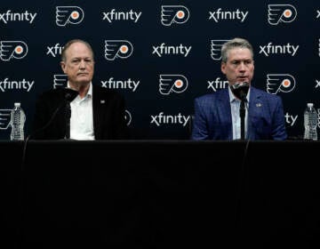 Philadelphia Flyers chairman Dave Scott, left, and Flyers general manager Chuck Fletcher take part in a news conference at the team's NHL hockey practice facility, Wednesday, Jan. 26, 2022, in Voorhees, N.J. The Flyers have lost a team-record 13 straight games