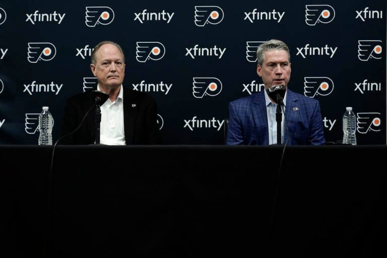 Philadelphia Flyers chairman Dave Scott, left, and Flyers general manager Chuck Fletcher take part in a news conference at the team's NHL hockey practice facility, Wednesday, Jan. 26, 2022, in Voorhees, N.J. The Flyers have lost a team-record 13 straight games