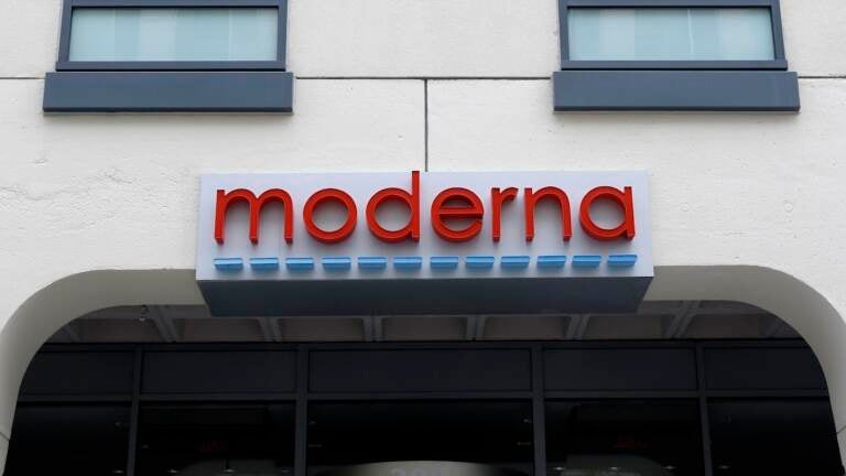 A sign marks an entrance to a Moderna, Inc., building, Monday, May 18, 2020, in Cambridge, Mass. Moderna announced Monday that an experimental vaccine against the coronavirus showed encouraging results in very early testing, triggering hoped-for immune responses in eight healthy, middle-aged volunteers.(AP Photo/Bill Sikes)