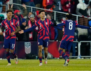 United States’ Antonee Robinson (5) celebrates his goal with Weston McKennie (8) and Chris Richards (15) during the second half of a FIFA World Cup qualifying soccer match against El Salvador, Thursday, Jan. 27, 2022, in Columbus, Ohio