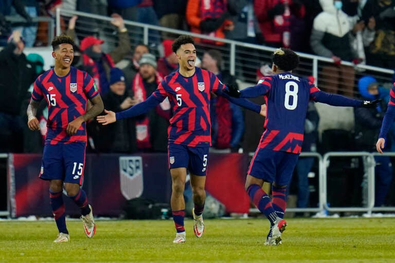 United States’ Antonee Robinson (5) celebrates his goal with Weston McKennie (8) and Chris Richards (15) during the second half of a FIFA World Cup qualifying soccer match against El Salvador, Thursday, Jan. 27, 2022, in Columbus, Ohio