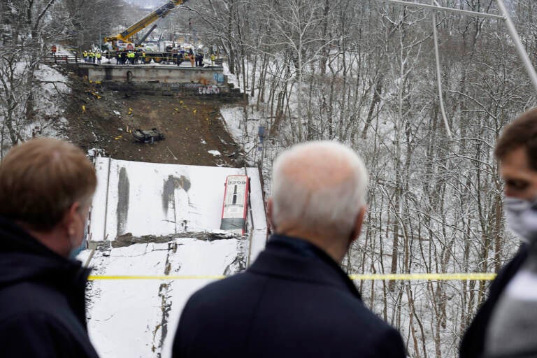 President Joe Biden visits the site where the Fern Hollow Bridge bridge collapsed Friday, Jan. 28, 2022, in Pittsburgh's East End. (AP Photo/Andrew Harnik)