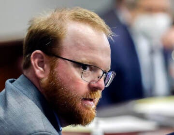 FILE - Travis McMichael is shown during the sentencing of he and his father Greg McMichael and neighbor, William 